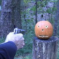 Carving a pumpkin with a gun like a pro